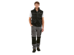 A man wearing a black PARKSIDE PERFORMANCE® work gilet, white t-shirt, and grey work trousers.