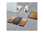Multi-port USB charger powering a laptop, tablet, and three smartphones on a grey surface.