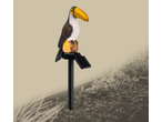 Livarno Decorative Solar Light: Toucan perched on a log with a solar panel, in a garden setting.