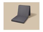 Dark grey foldable floor cushion on a light beige background.
