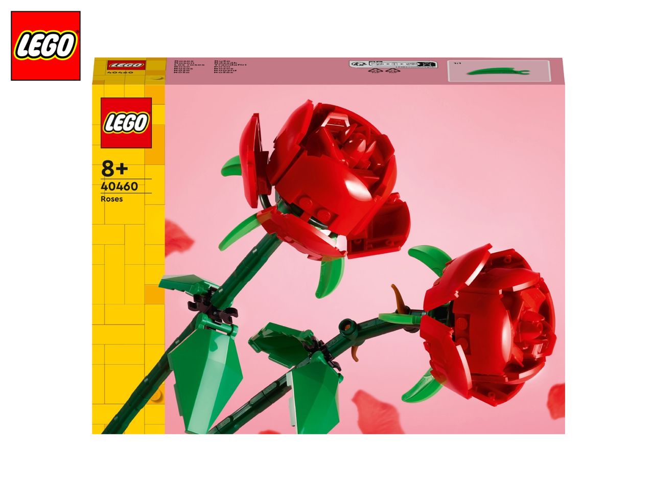 Two red roses made of building blocks on a pink background, with product packaging.