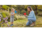 Lupilu Outdoor Toy Sets: A mother and child playing with catch ball toys in a garden.