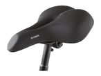 A black Crivit bicycle saddle is mounted on a black seatpost.