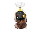 Deluxe Vanilla Truffles covered with milk chocolate, in a clear bag with a yellow label.