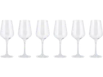 Six clear champagne flutes with long stems and wide bases on a black background.