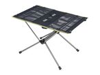 Portable camping table with a dark mesh top and light green trim, on a silver frame.