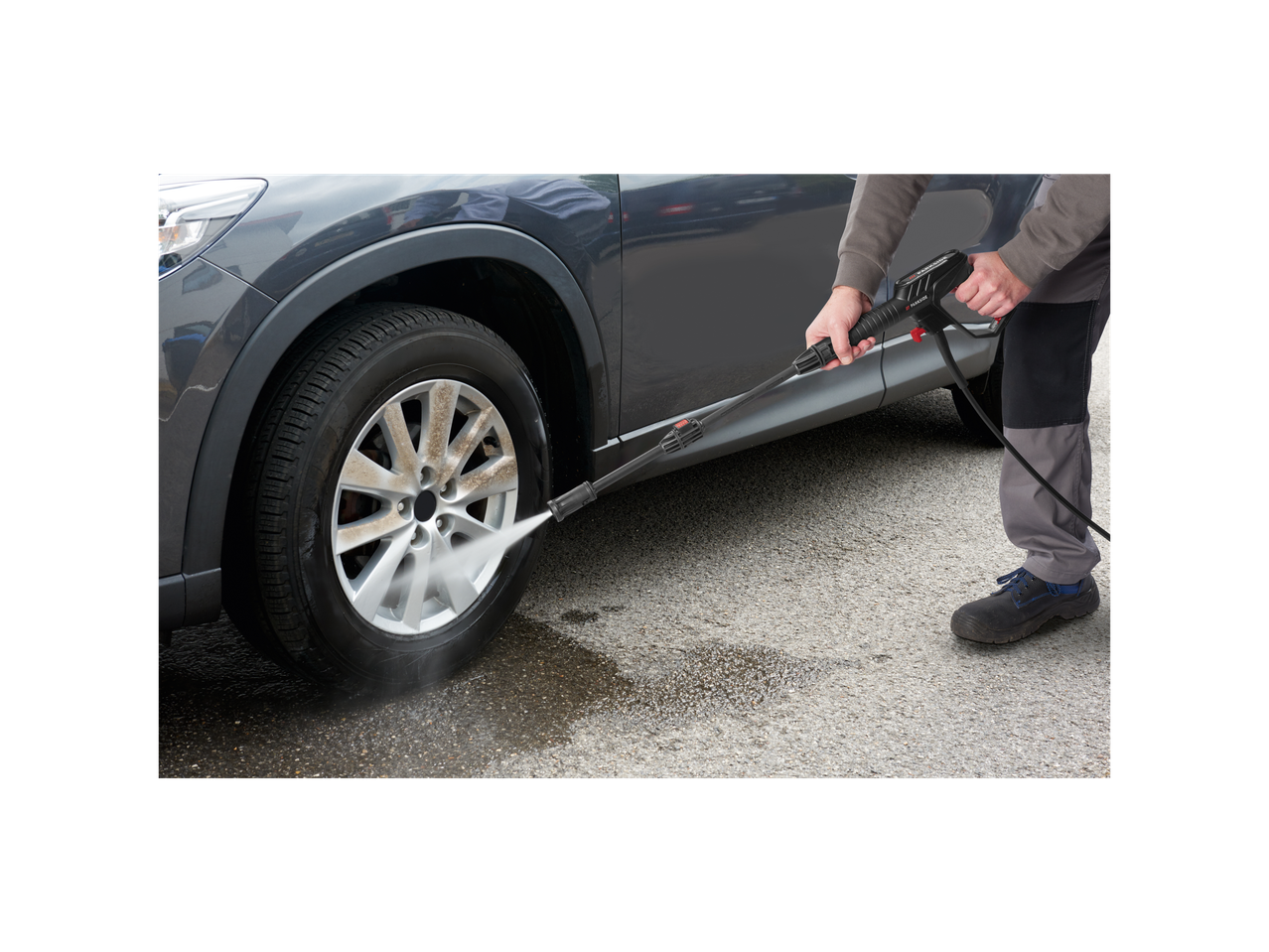 Car wheel cleaning with Parkside pressure washer.