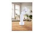 White adjustable LED spotlight on a wooden table with a blurred office background.