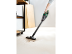 A person uses a PARKSIDE® 20V Cordless Handheld Vacuum Cleaner to clean up debris.