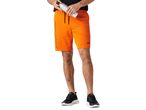 A man in black t-shirt and orange shorts holding a silver water bottle.
