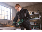 Woman using a PARKSIDE® angle grinder, creating sparks while working on metal.