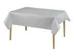 Table with a light grey tablecloth featuring a subtle leaf pattern.