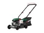 A green and black petrol lawnmower with a grass collection bag.