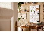 A home office with a whiteboard displaying a 'to do' list and calendar, featuring Crelando accessories.