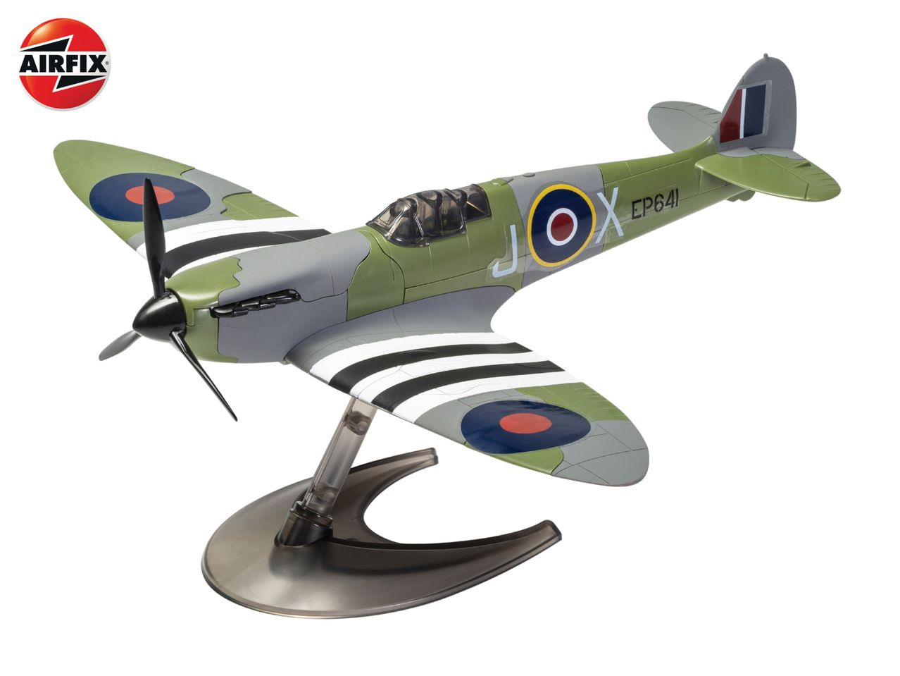 A model airplane, a Spitfire, in green and grey camouflage with a propeller and a stand.