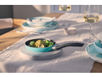 SILVERCREST® Mini Pan Assortment with green peppers and lemon on a dining table.