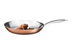 Copper-colored frying pan with stainless steel interior containing cooked meat and herbs