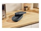 A gray microwave steamer on a wooden kitchen counter next to a SilverCrest microwave.