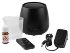 Black aroma diffuser with remote control, measuring cup, essential oil, and power adapter.