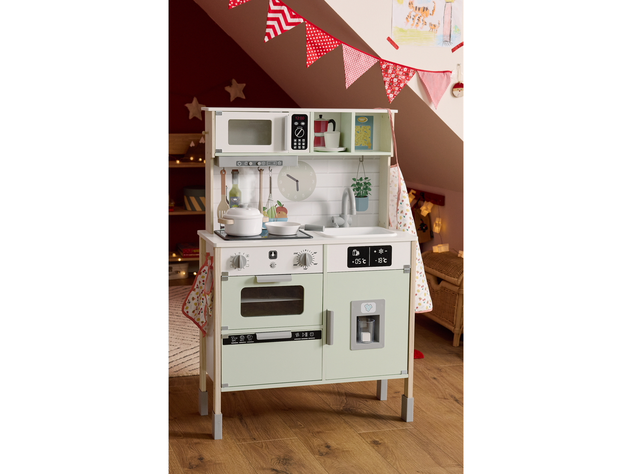 Lupilu wooden play kitchen with microwave, oven, and refrigerator in a child's room.