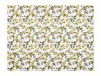 White tablecloth with a repeating pattern of yellow lemons on branches with green leaves.