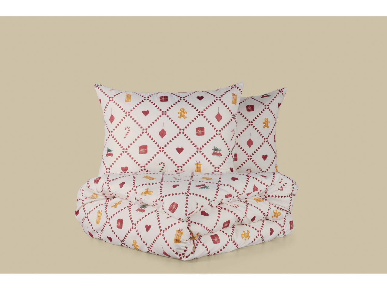 LIVARNO satenska posteljina s božićnim uzorcima, uključujući jastuke i poplun.