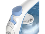Close-up of an iron with temperature and steam settings.