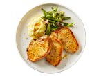 Three golden-brown pork chops with mashed potatoes and green beans on a white plate.