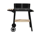 Black barbecue grill with wooden shelves and wheels.