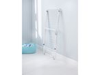 A white foldable laundry drying rack stands against a light blue wall, next to a light blue laundry basket.