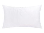 White quilted pillow with a wavy stitch pattern