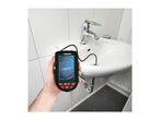 Hand holding an inspection camera with its probe in a sink drain.