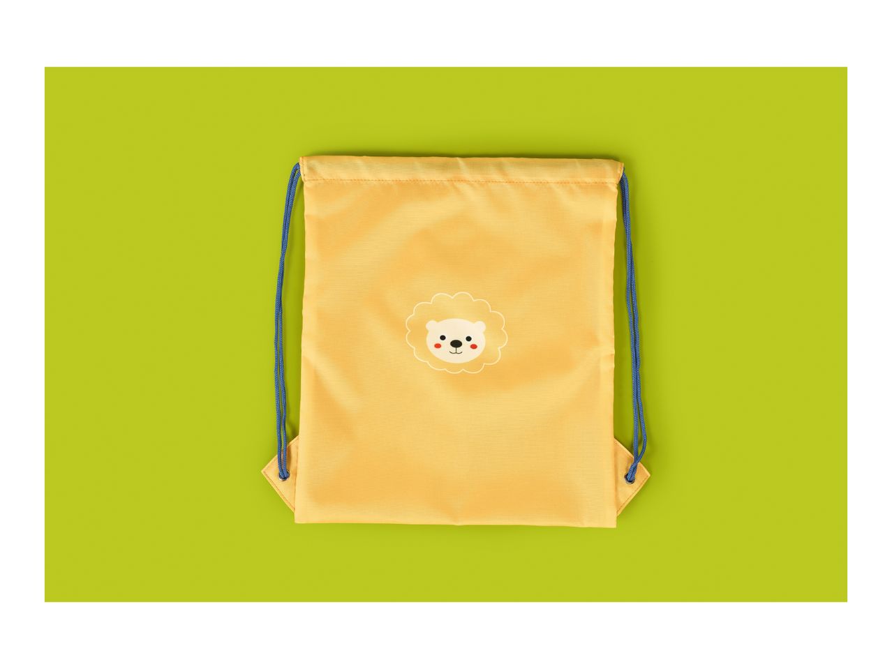 Yellow drawstring bag with a cute lion face design on a green background.