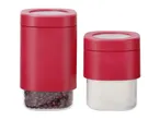 Two red and clear food storage containers, one filled with red beans, the other with white powder.