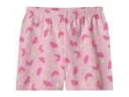 Pink children's shorts with moon, cloud, and star patterns.