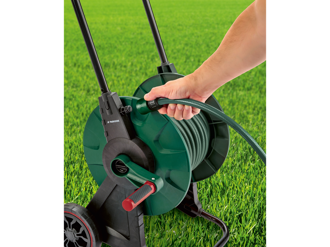 Parkside hose reel with hose on lawn.