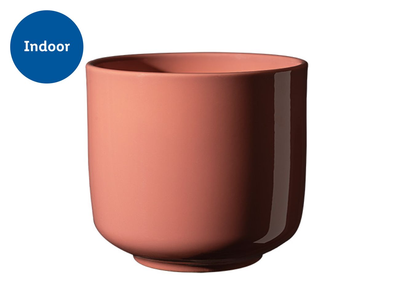 Indoor plant pot in a terracotta color with a glossy finish on one side.