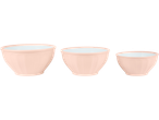 Three pink plastic cups of varying sizes, filled with a light blue liquid.