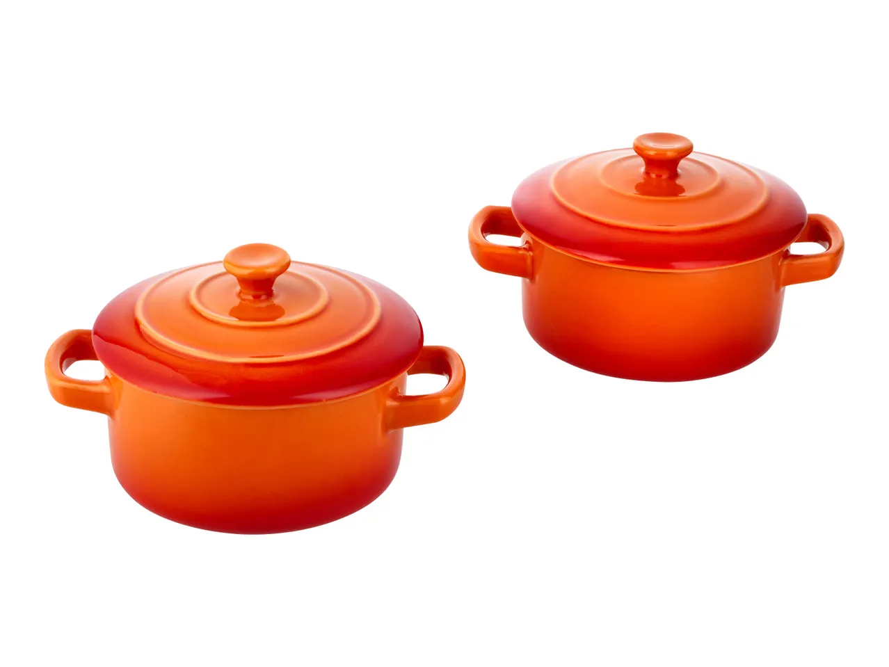 Two orange ceramic mini casserole dishes with lids and handles.