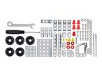 A set of construction toys including metal plates, screws, wheels, and tools.