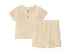 Sæt med kortærmet skjorte og shorts i beige musselin til babyer.