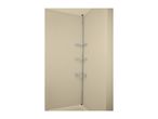 A chrome tension pole shower caddy with three corner shelves in a beige shower.