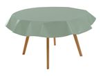 Round table with a light green tablecloth and wooden legs