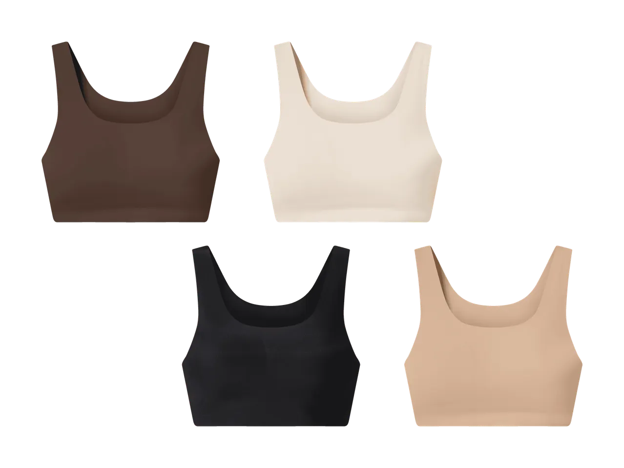 Cinque brassiere sportive a tinta unita in marrone, beige, nero e nude.