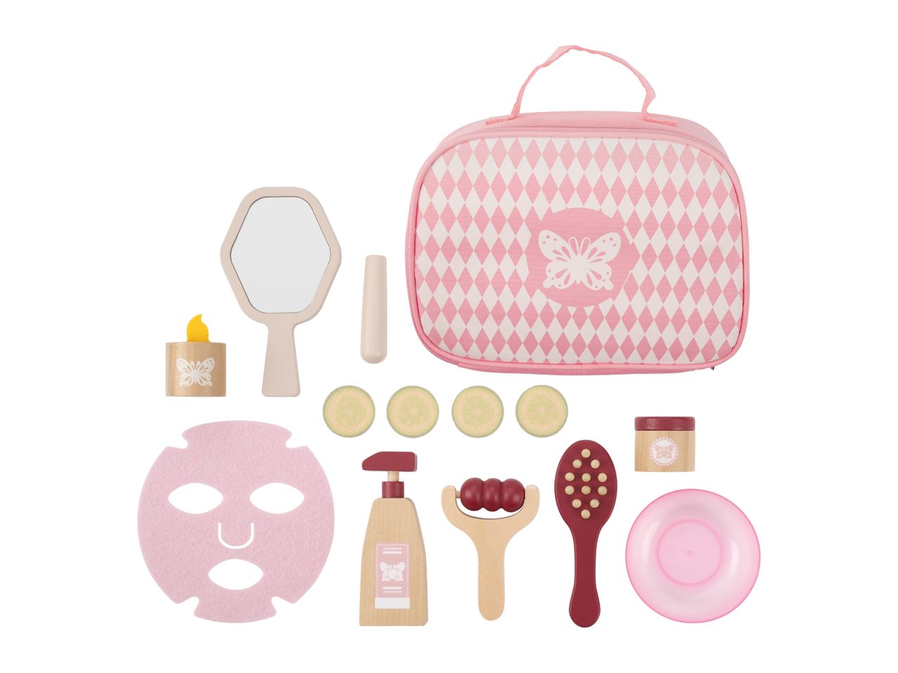 Pink toy spa set with a bag, mirror, face mask, cucumber slices, and various wooden beauty tools.
