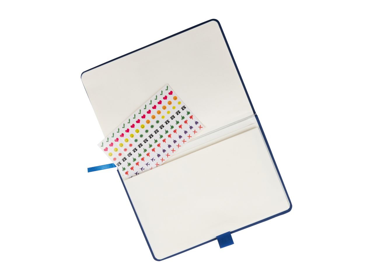 A navy blue notebook lies open, revealing a sheet of colorful emoji stickers tucked inside.