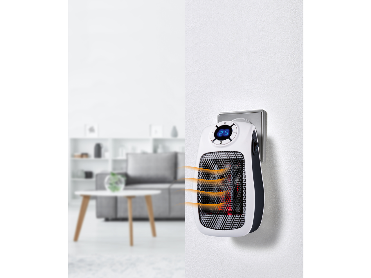 TRONIC® 600W Ceramic Plug Heater plugged into a wall socket, heating a living room.