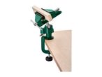 Green table vice with a wooden block clamped, attached to a light wooden surface.