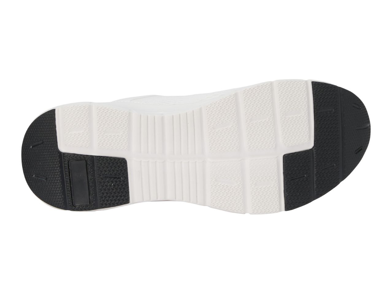 Bottom view of a white and black athletic shoe sole with textured patterns.