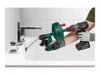 Person using a drain cleaner attached to a cordless drill to clear a sink.